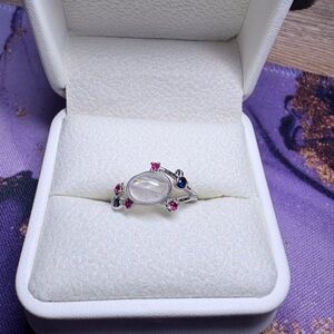 White moonstone ring with colorful accents